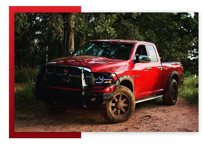 red Ram truck driving in the woods
